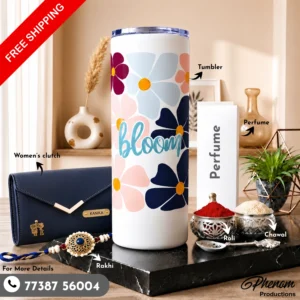 Floral bloom tumbler hamper showcasing a personalized blue clutch and pastel floral insulated tumbler Complete display of the floral bloom tumbler hamper with festive roli, chawal, and luxury perfume