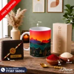Sunset mountain mug hamper showcasing a custom engraved wallet, mountain ceramic mug, perfume, Rakhi, roli, and chawal Flat lay setup of the sunset mountain mug hamper featuring landscape-inspired accessories and personalized items