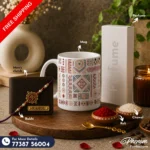 Tribal art mug hamper showcasing a custom engraved wallet, tribal ceramic mug, perfume, Rakhi, roli, and chawal Flat lay setup of the tribal art mug hamper featuring ethnic heritage accessories and personalized items