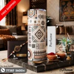 Tribal art tumbler hamper showcasing a custom engraved wallet, tribal tumbler, perfume, Rakhi, roli, and chawal Flat lay setup of the tribal art tumbler hamper featuring ethnic heritage accessories and personalized items
