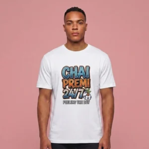 A man wearing a white t-shirt featuring the Chai Premi 24/7 Fueling The Day graphic.