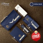 Royal blue women's wallet hamper featuring a custom engraved clutch, passport cover, keychain, and sunglasses case Unboxing layout of the royal blue women's wallet hamper showcasing personalized leather accessories and mini perfume