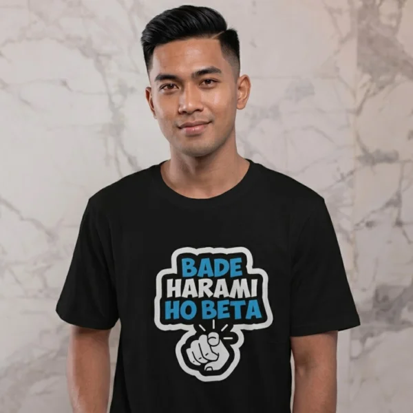 Man wearing a t-shirt featuring a pointing hand graphic and the text BADE HARAMI HO BETA