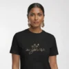 Close-up chest graphic detail of the be you tiful t-shirt featuring scripted typography and wildflower illustration