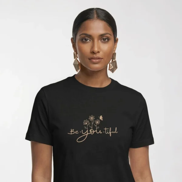 Close-up chest graphic detail of the be you tiful t-shirt featuring scripted typography and wildflower illustration