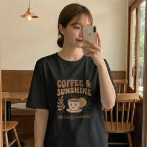 Chest graphic detail of coffee and sunshine t shirt featuring vintage typography and sun motif