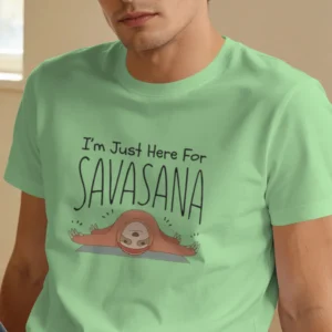 Close-up chest view of the im just here for savasana t shirt illustrated sloth and typography detail