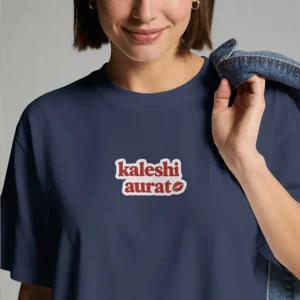 Close-up chest graphic detail of the kaleshi aurat t-shirt featuring retro font and kiss mark patch art