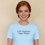 Close-up chest graphic detail of the life happens yoga helps t-shirt featuring centered dark typewriter font