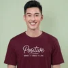 Close-up chest view of the positive mind vibes life t shirt script and mantra typography