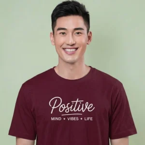 Close-up chest view of the positive mind vibes life t shirt script and mantra typography