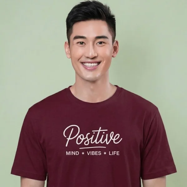 Close-up chest view of the positive mind vibes life t shirt script and mantra typography